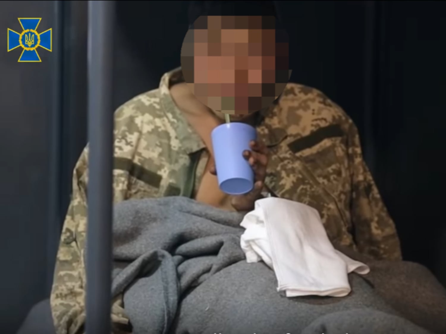 Part of the image, made from the video’s 35-second mark, has been blurred by RFA.