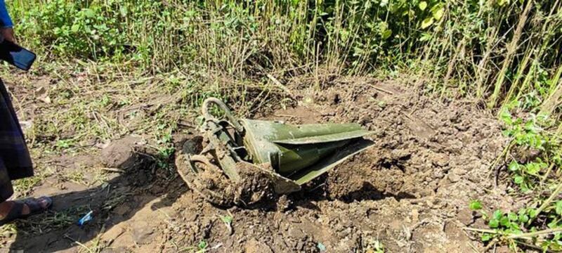 A munition fragment from a Myanmar military jet lies on the ground in Kawlin township, Sagaing region, Aug. 24, 2022. Credit: Kawlin Revolution-KR