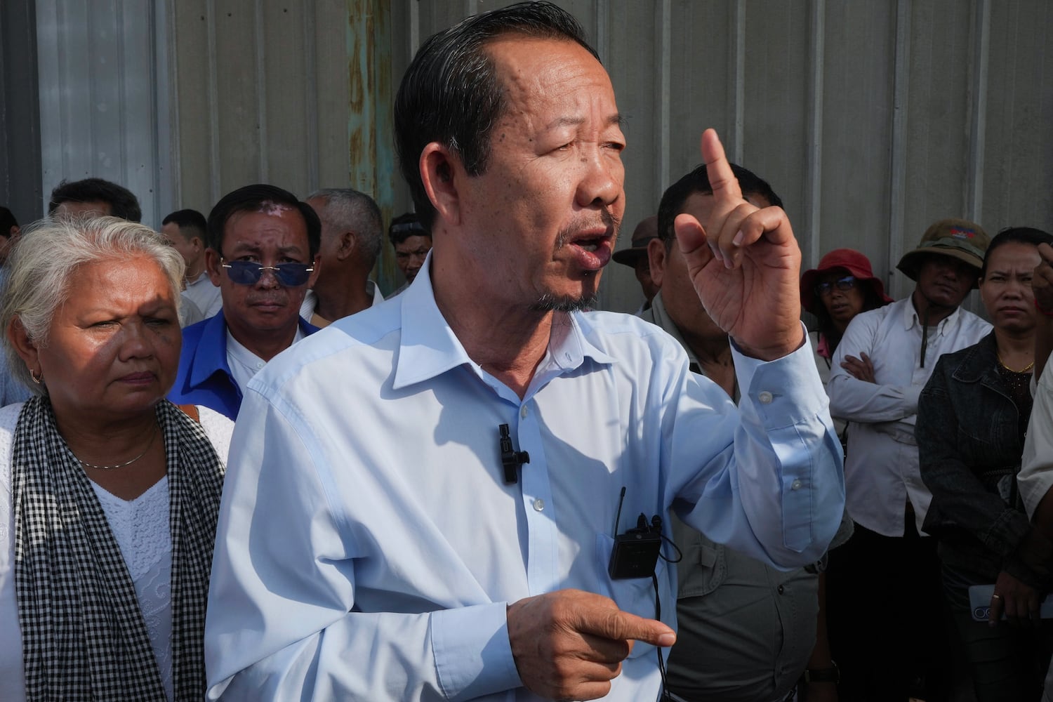Prominent Cambodian opposition politician Rong Chhun speaks near the Phnom Penh Municipal Court, May 5, 2025.