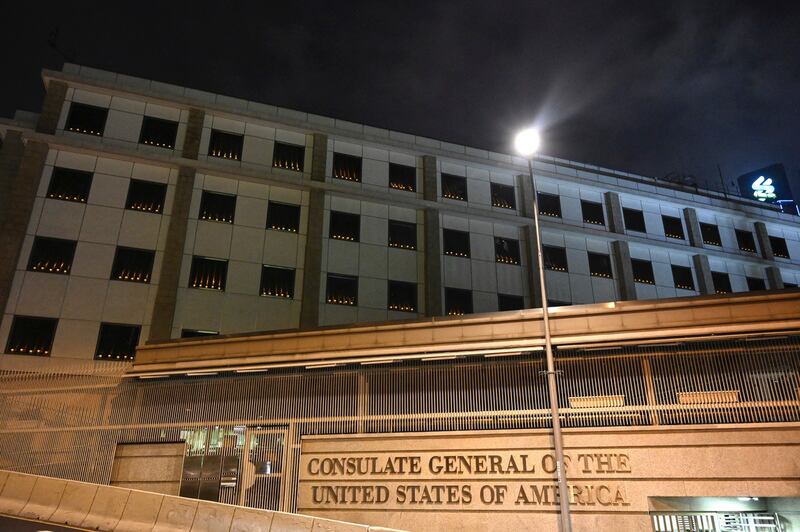 Candles are seen lit in the windows of the United States Consulate on the occasion of the 32nd anniversary of Beijing's deadly Tiananmen Square crackdown in 1989, in Hong Kong, June 4, 2021. Credit: AP