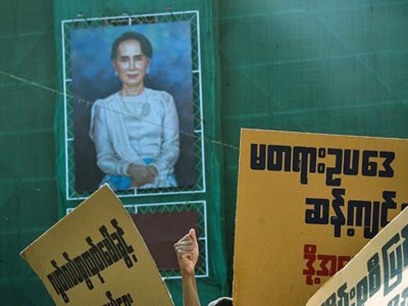 A portrait of Myanmar State Counselor Aung San Suu Kyi is seen as activists demonstrate against what they say are repressive proposed amendments to the country's Peaceful Assembly and Procession Law, in Yangon, March 5, 2018.