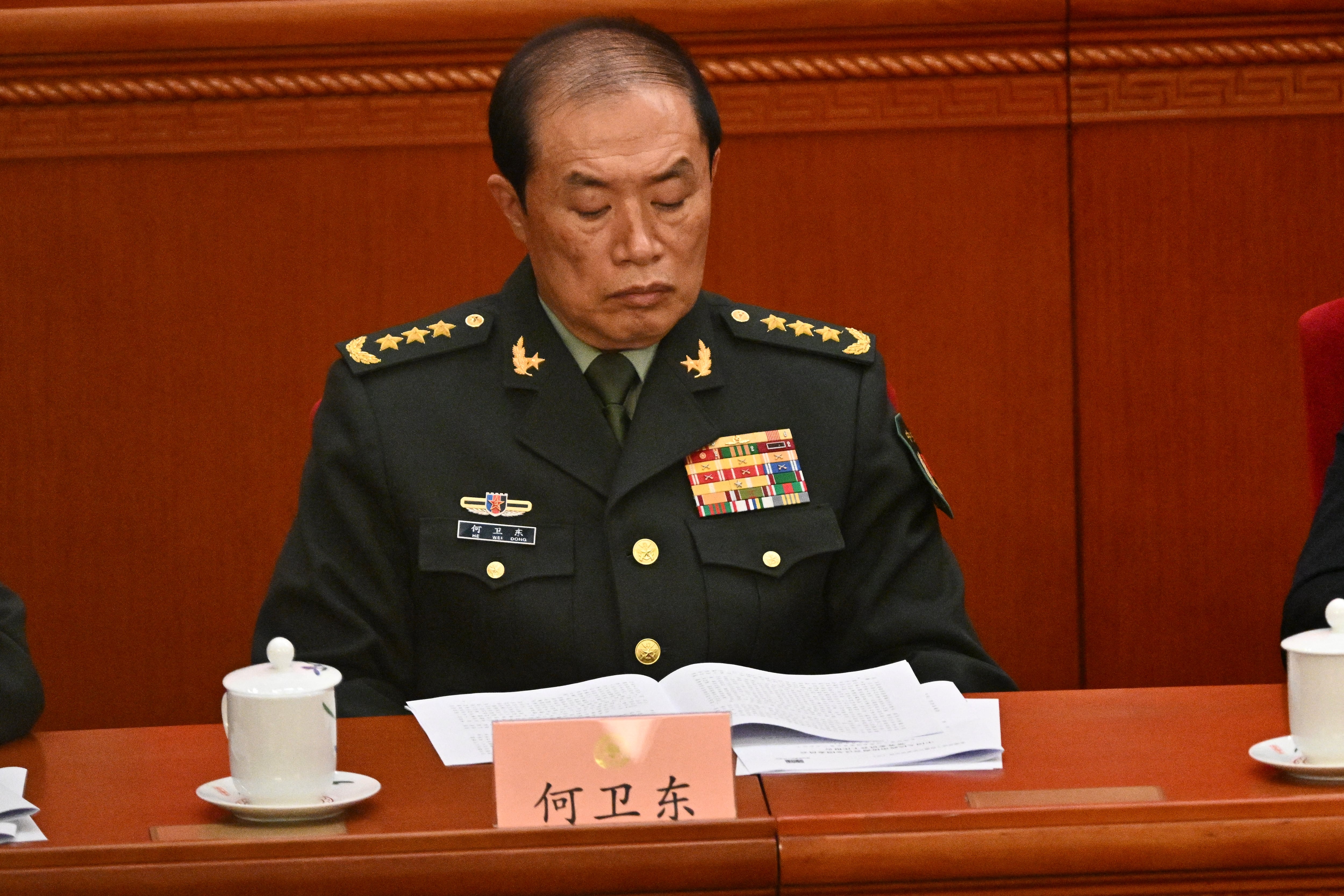 He Weidong, second-ranked vice chairman of China's Central Military Commission (CMC), attends the opening ceremony of the Chinese People's Political Consultative Conference (CPPCC) at the Great Hall of the People in Beijing on March 4, 2025. (Photo by Pedro PARDO / AFP)