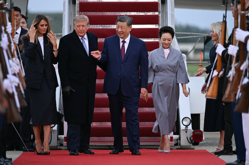 U.S. President Donald Trump and first lady Melania Trump greet Chinese President Xi Jinping and China's First Lady Peng Liyuan upon arrival at Joint Base Andrews in Maryland on Sept. 23, 2026.