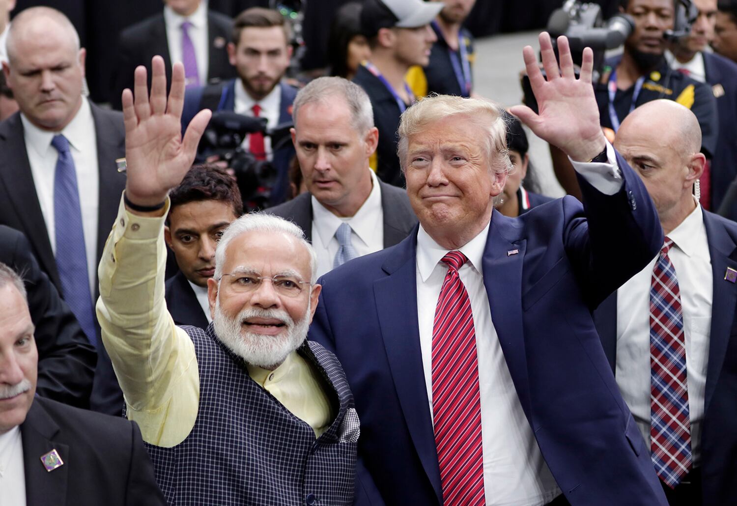 India Prime Minister Narendra Modi and then-President Donald Trump greet attendants after Modi's speech on Sept. 22, 2019 in Houston. (AP) 