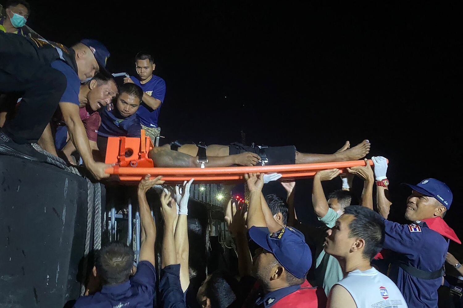 An injured fisherman on a stretcher at Ranong in Thailand near the Myanmar border, taken on Nov. 30 and released on Dec. 2, 2024.