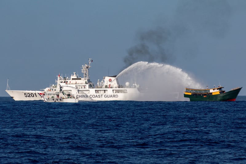 Chinese Coast Guard vessels fire water cannons towards a Philippine resupply vessel Unaizah May 4 on its way to a resupply mission at Second Thomas Shoal in the South China Sea, March 5, 2024.