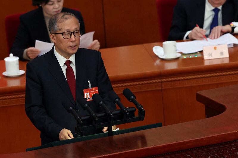 2024年3月5日，中国第十四届全国人大第二次全体会议在北京人民大会堂开幕，人大常委会副委员长李鸿忠作关于国务院组织法修订草案的说明。（路透社）