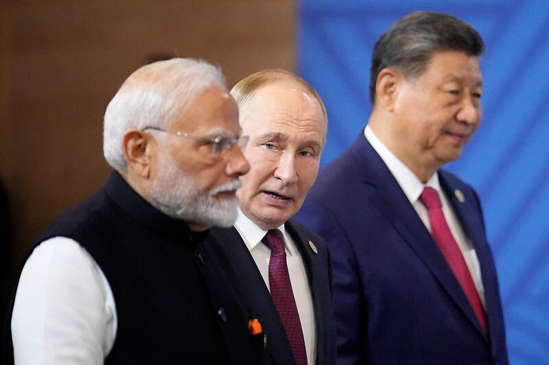 India’s Prime Minister Narendra Modi, Russia’s President Vladimir Putin and China’s President Xi Jinping attend a photo ceremony at the BRICS Summit in Kazan, Russia, Oct. 23, 2024.
