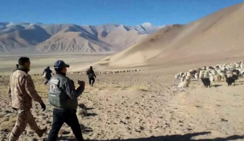 Chinese soldiers chase away local nomads and their livestock from the Belung and Daklung grazing areas onear the border of India and Chinese-controlled Tibet, Jan. 2, 2024. (Kunsang Namgyal/video screenshot)