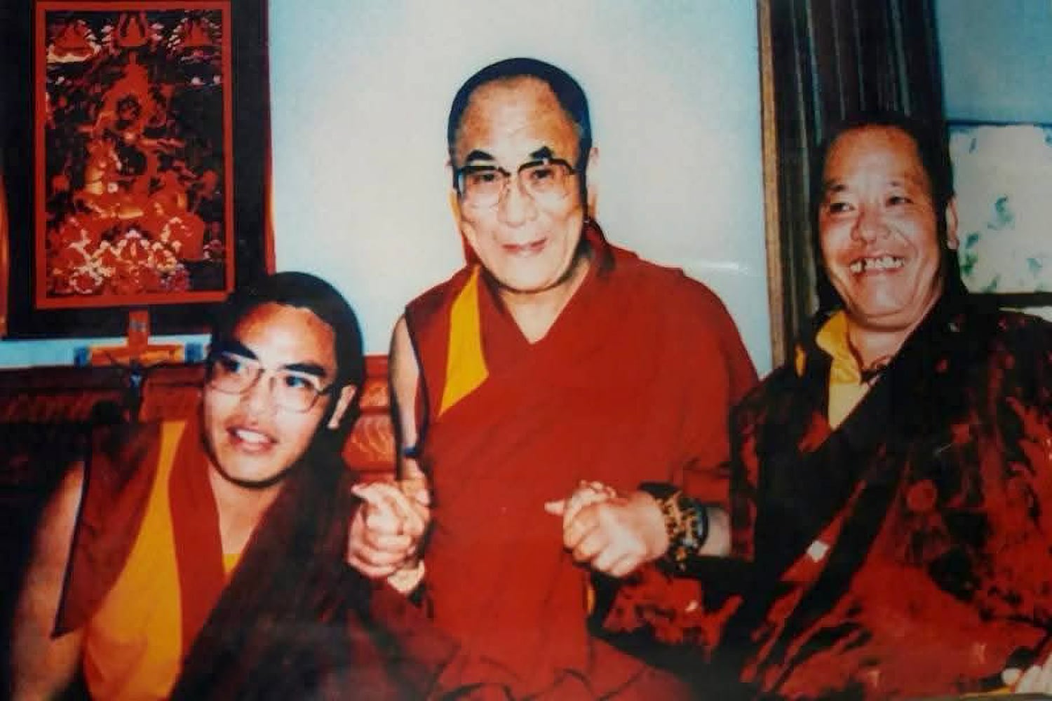 A young Tulku Hungkar Dorje, left, and his father Kusum Lingpa, right, a renowned Nyingma tradition Buddhist master, with the Dalai Lama in the early 1990s.