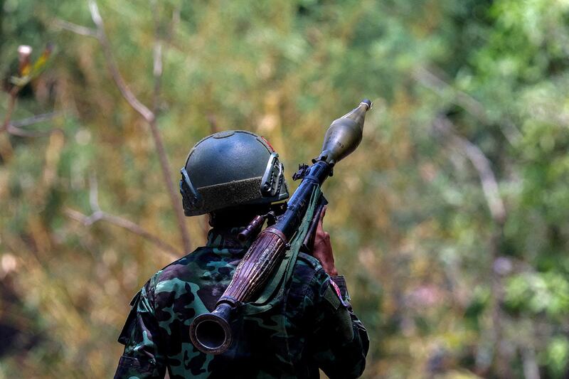 A Karen National Liberation Army soldier carries an RPG launcher at a Myanmar military base at Thingyan Nyi Naung village on the outskirts of the Thailand-Myanmar border town of Myawaddy, April 15, 2024. (Athit Perawongmetha/Reuters)