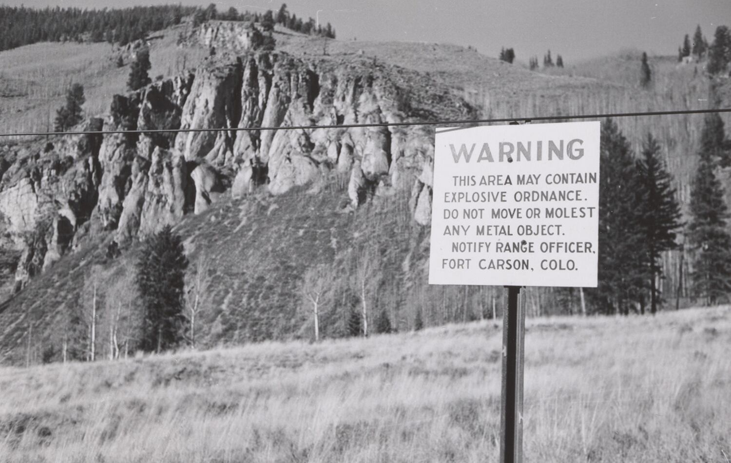 A sign in the early 1960s warns of “explosive ordnance” in the Camp Hale area. To maintain the secrecy around Camp Hale and keep locals at bay, the CIA created a false story of atomic testing programs being conducted there.