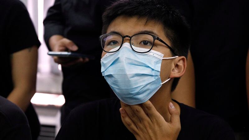 香港泛民初选获选的人士于2020年7月15日举行记者会，图为黄之锋。（美联社）