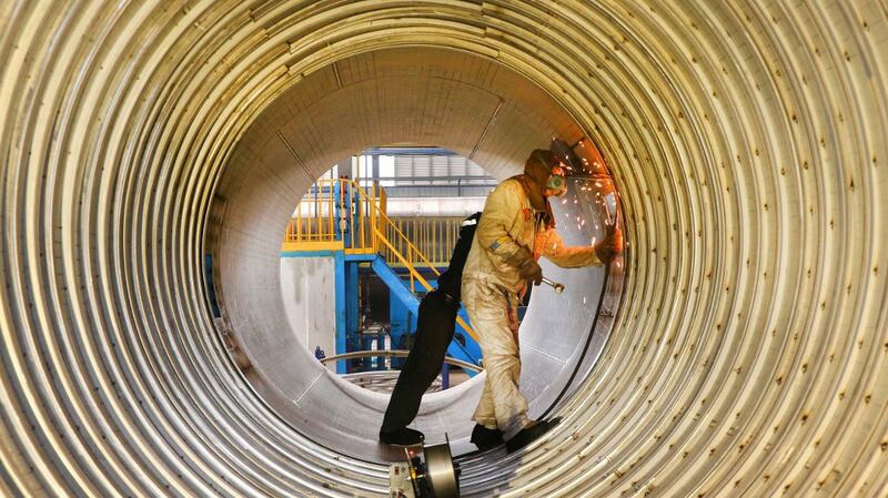 A worker welds a liquefied natural gas (LNG) tank at a factory in Nantong in China's eastern Jiangsu province, March 14, 2019.