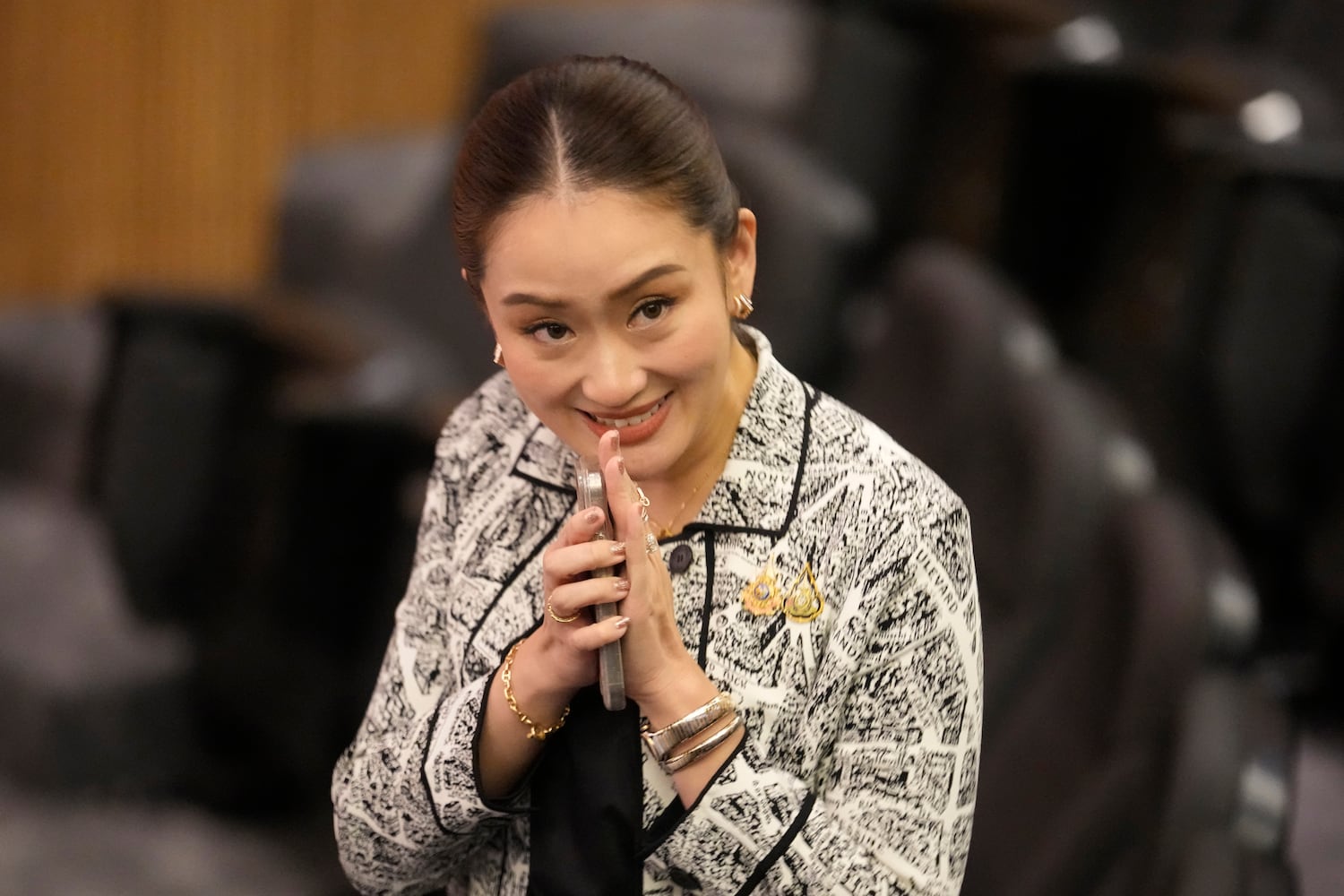 Paetongtarn Shinawatra smiles during a news conference announcing she will be Pheu Thai Party-led coalition’s candidate for prime minister, Aug. 15, 2024. [Sakchai Lalit/AP]
