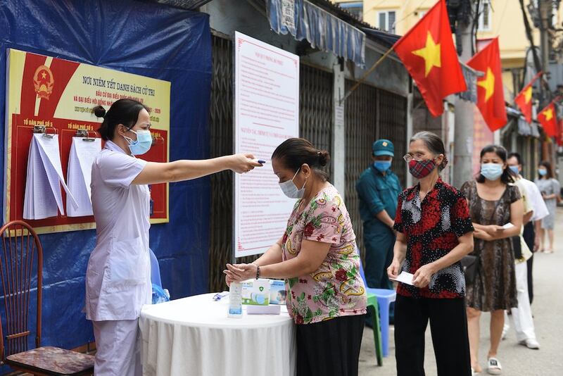 2021-05-23T141026Z_675388589_RC2KLN9YJWGW_RTRMADP_3_VIETNAM-POLITICS-ELECTION.JPG