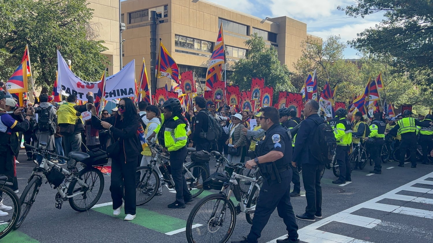 Police watch as Tibet protesters march near the Chinese Embassy in Washington as Chinese President Xi Jinping meets with U.S. President Trump at the White House, Sept. 24, 2026.