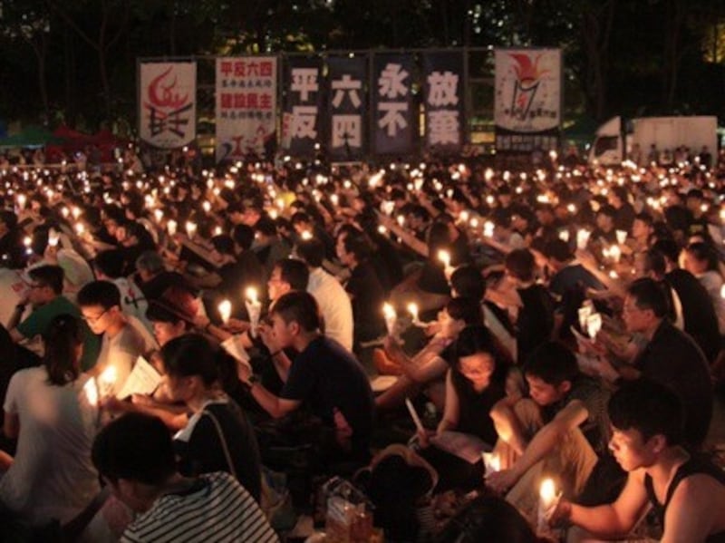A 2014 photo shows people attending a candlelight vigil in Victoria Park to commemorate the 25th anniversary of the June 4th Tiananmen crackdown.