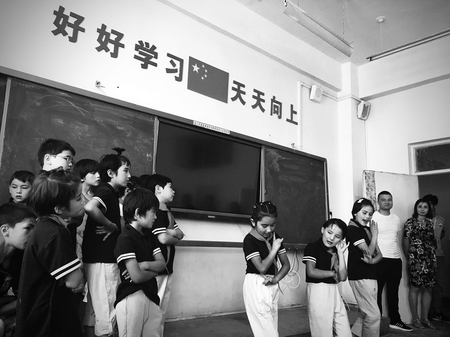 Students at the Paxiang Central Primary School perform during a 2019 trip to northwestern China's Xinjiang region by a Taiwanese delegation that included high-school students.