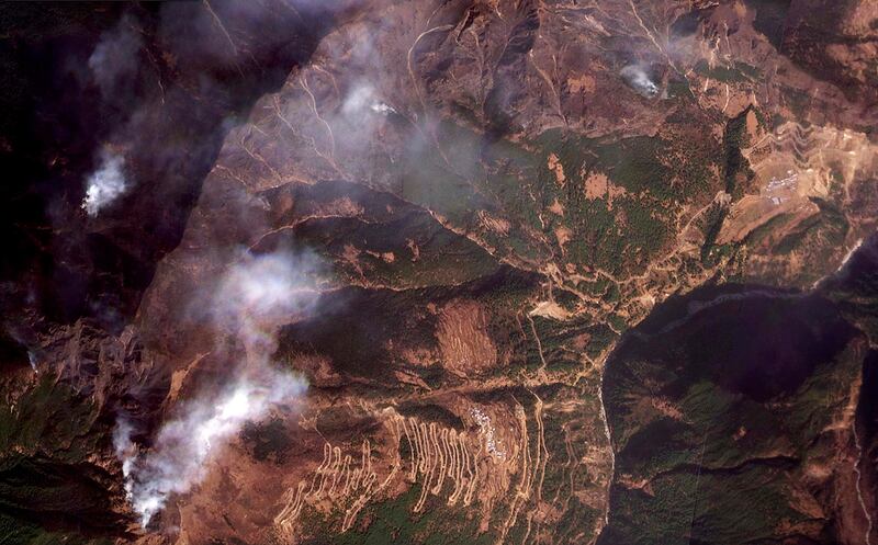 Smoke rises from the forest fire in Kyirong county, Tibet, Feb. 3, 2025.