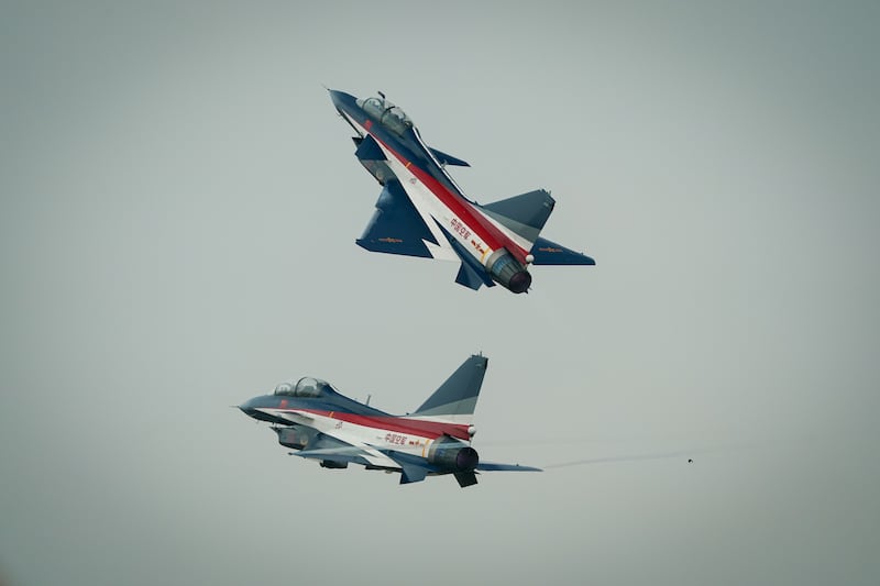Chinese People’s Liberation Army Air Force Chengdu J-10 jets perform over Don Mueang airbase in Bangkok, March 7, 2025.