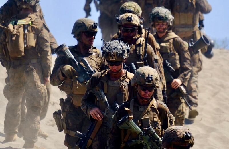 U.S. troops leave a hill on a beach in Laoag city, northern Philippines, during  U.S.-Philippine exercises, May 6, 2024. [Jason Gutierrez/BenarNews]