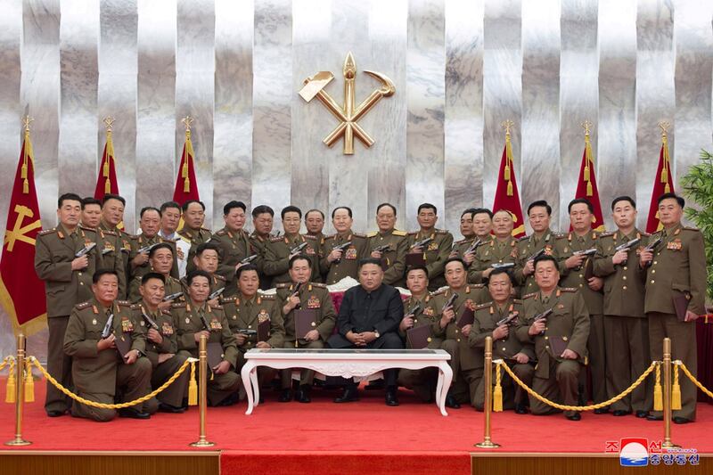 Kim Jong Un poses for a photograph after conferring "Paektusan" commemorative pistols to leading commanding officers of the armed forces on the 67th anniversary of the "Day of Victory in the Great Fatherland Liberation War," which marks the signing of the Korean War armistice, in this photo released July 27, 2020. (KCNA via Reuters)