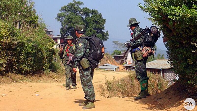 Soldiers from the Restoration Council of Shan State/Shan State Army-South pass through a village in Myanmar's Shan state in an undated photo.