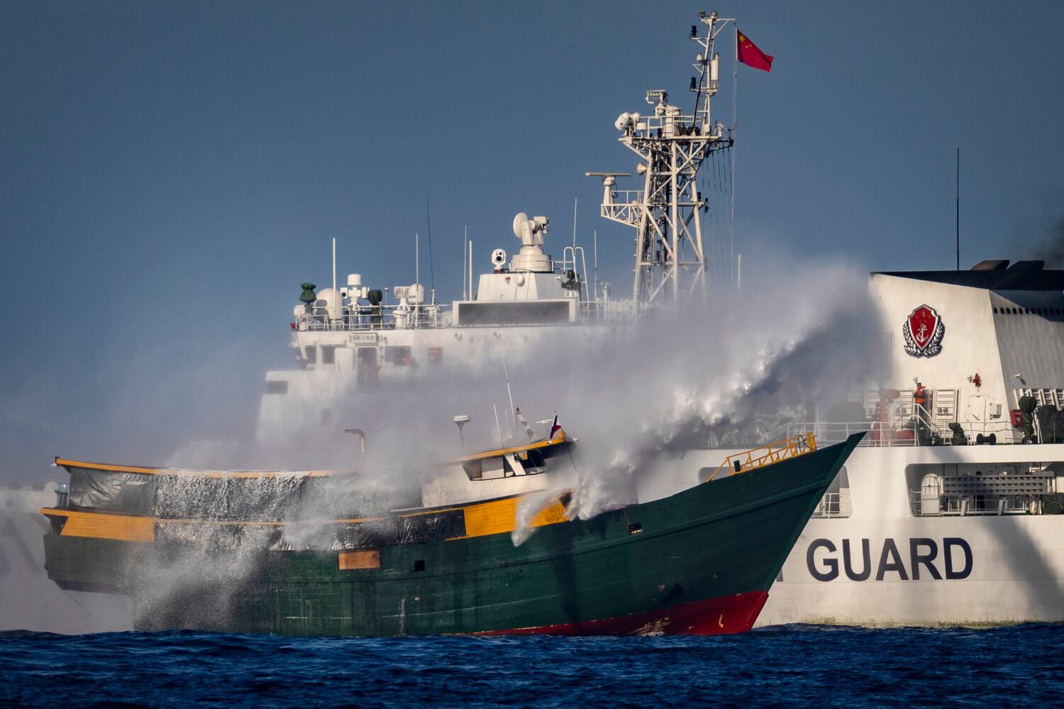 Philippines: 4 boat crew hurt as China Coast Guard fires water cannon