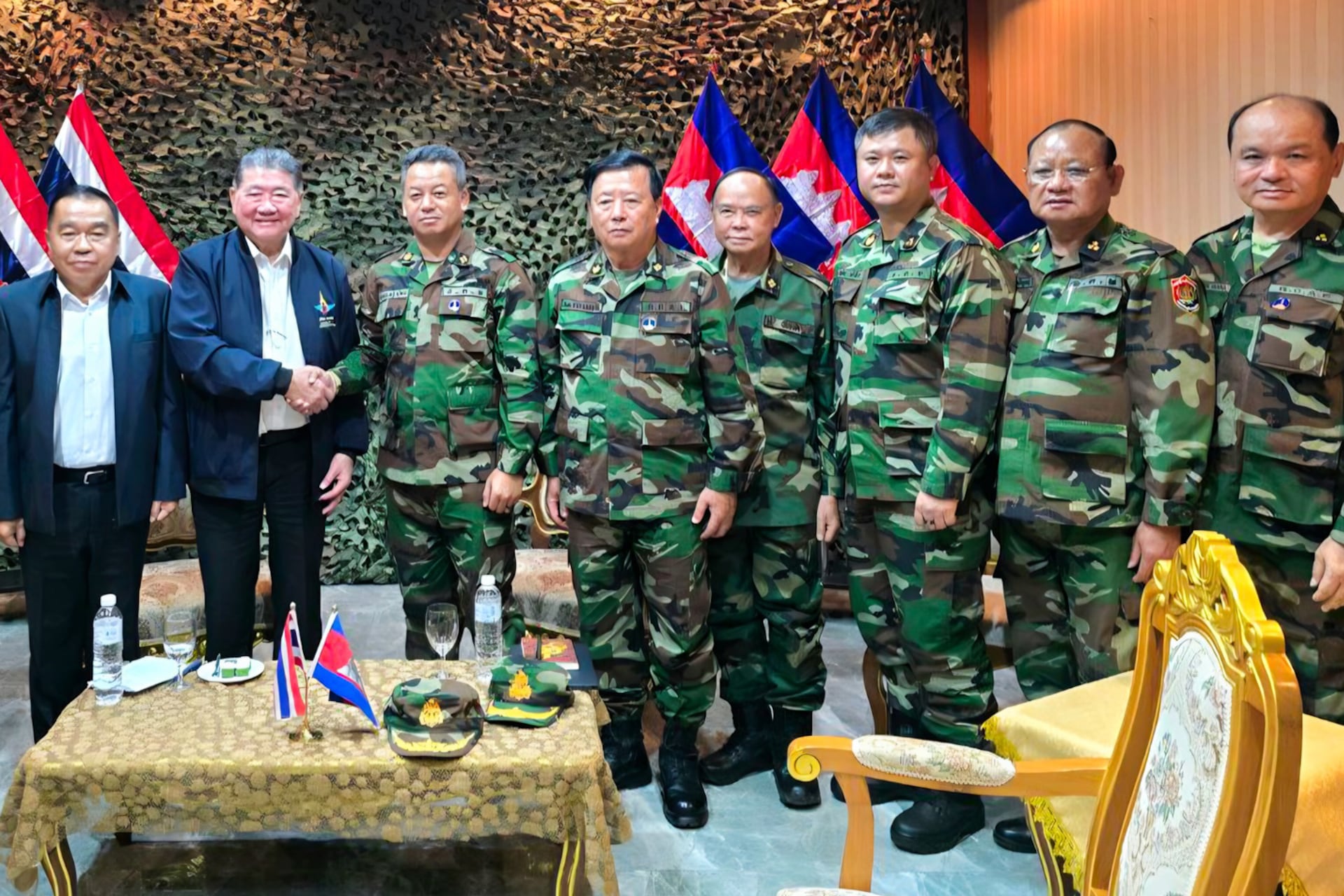 Cambodian Defense Minister Tea Siha (R) shakes hand with Thailand Defense Minister.