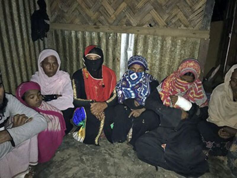 Rohingya Muslim women, sheltered in a house at Kutupalang Rohingya camp in Bangladesh, talk about the abuse they endured during security operations in western Myanmar's Rakhine state, Jan. 27, 2017.