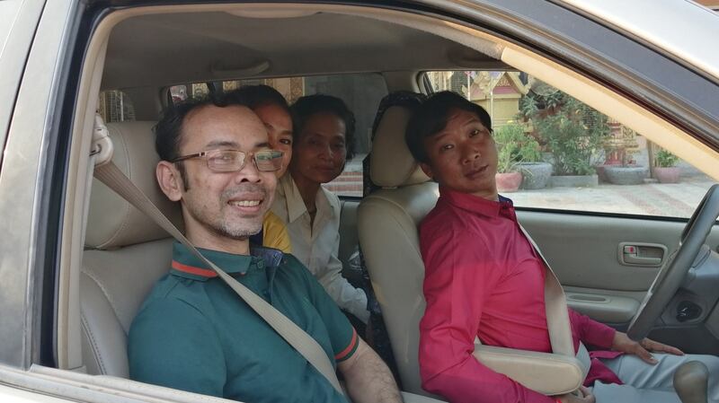 Mai Hong Sreang (far left) prepares to visit a pagoda to receive a blessing following his release from prison, April 3, 2020. Credit: RFA