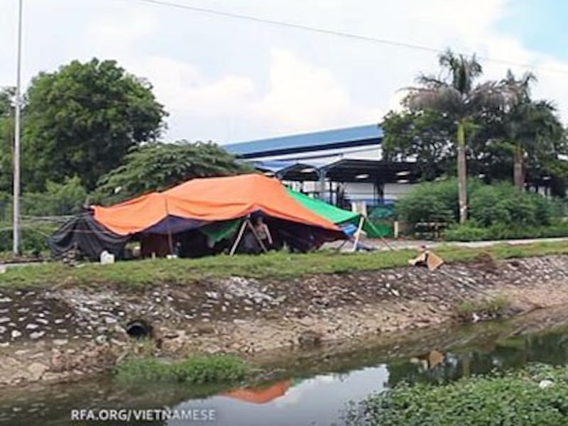 A large tent set up by Vietnamese protesters blocks the entrance to the Pacific Crystal textile factory in Lai Vu Commune, Kim Thanh district, in northern Vietnam's Hai Duong province, Sept. 2017.