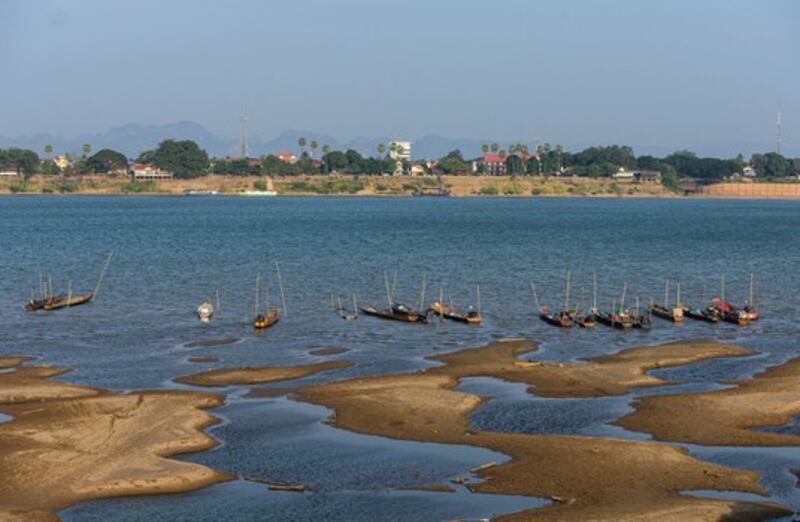 The waters of the Mekong River in Nakhon Phanom province, northeastern Thailand, turned blue instead of its usual muddy color because of the upstream dams, as pictured in this photo of moored boats on Dec. 4, 2019. Credit: AP