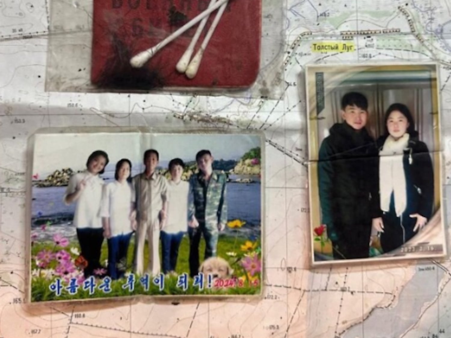 Family photos, presumably taken in August 2024 and March 2023, found with the bodies of North Korean troops killed in the Ukraine-Russia war.