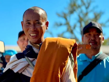 Bodyguard for Vietnamese monk controls his every move