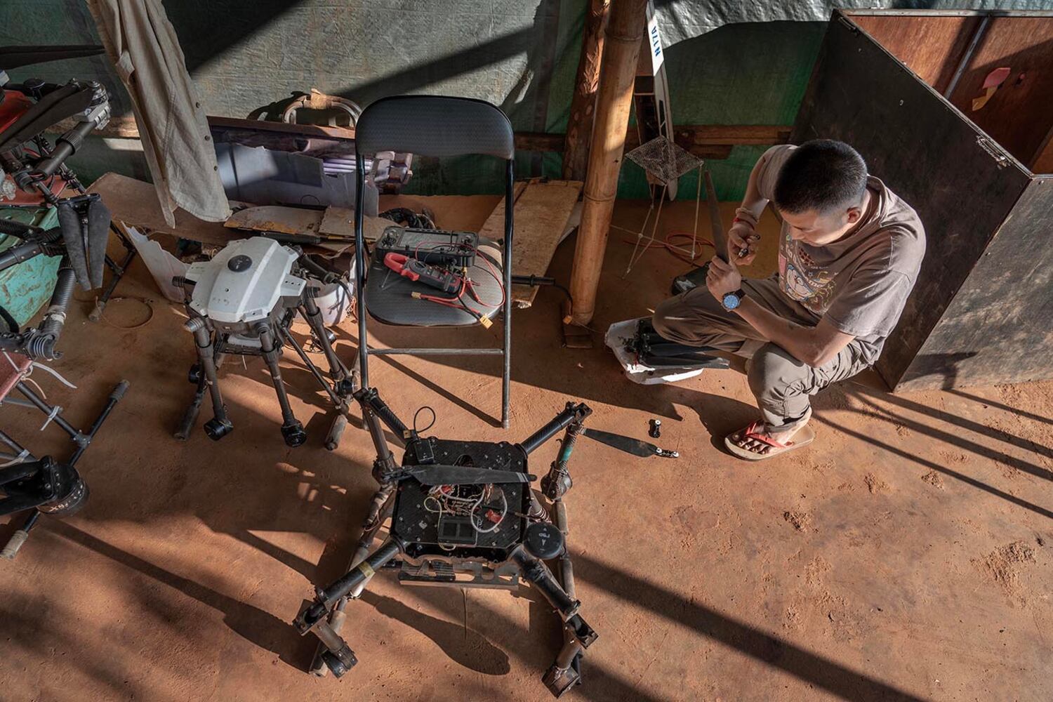 A technician assembles a drone at a KNDF base in Demoso, Kayah state, Myanmar, Nov. 2, 2024.