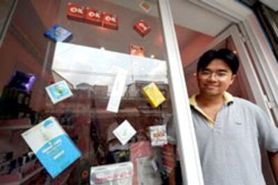 Anh Khánh Phong, chủ tiệm bán bao cao su phòng ngừa lây nhiễm HIV, ở TPHCM. AFP 