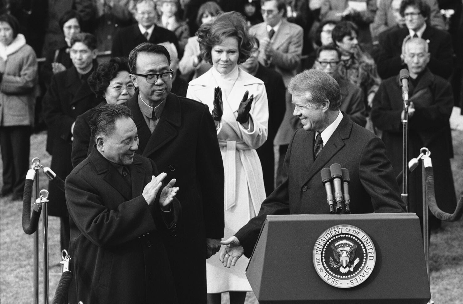 Chinese Vice Premier Deng Xiaoping applauds US President Jimmy Carter after Carter welcomed Deng in a South Lawn ceremony at the White House, Jan. 29, 1979.