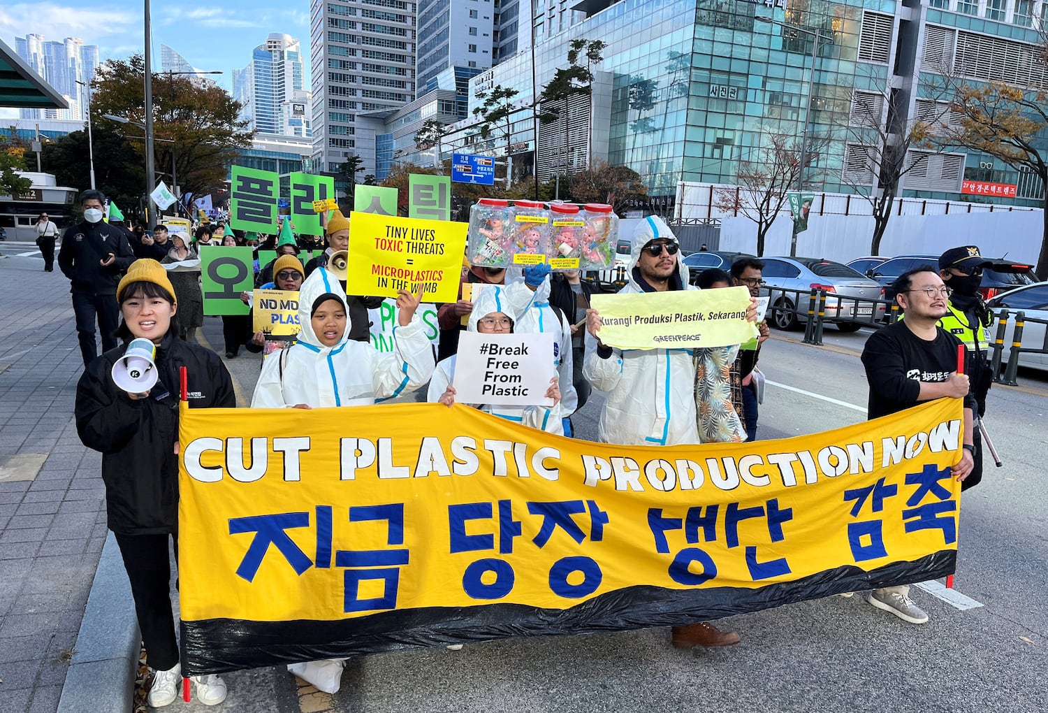 Climate activists march on a street to demand stronger global commitments to fight plastic waste at the upcoming fifth session of the Intergovernmental Negotiating Committee in Busan, South Korea, Nov. 23, 2024