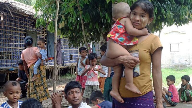 Ethnic Rakhine villagers, who fled from conflict between the Myanmar military and the Arakan Army, arrive at a temporary monastery camp in Sittwe, western Myanmar's Rakhine state, June 29, 2020.