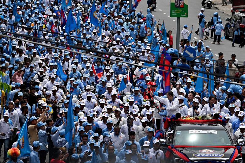 Hun Manet greets supporters during a campaign rally in Phnom Penh in July 2023. Prime Minister, Hun Manet, will meet with Cambodia's aggravated private sector for his administration's first Government-Private Sector Forum in November which his nascent government has been preparing for months. Credit: Tang Chhin Sothy/AFP