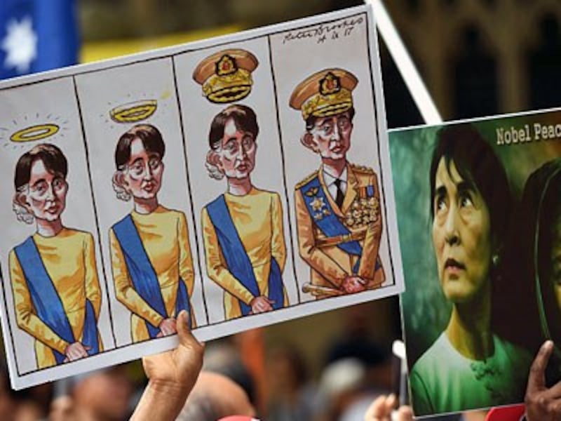 Posters referring to Myanmar's State Counselor Aung San Suu Kyi are displayed at a demonstration during the ASEAN-Australia Special Summit in Sydney, March 17, 2018.