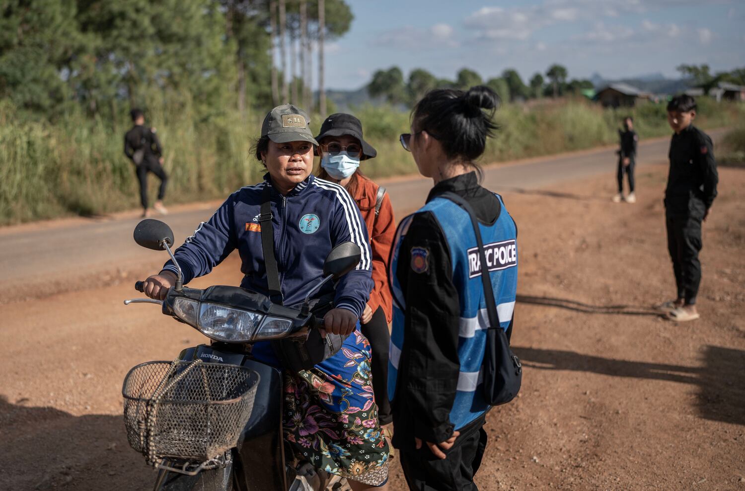 A female officer with KSP Station 8 explains the checkpoint, in southern Shan state, Myanmar, Nov. 4, 2024.