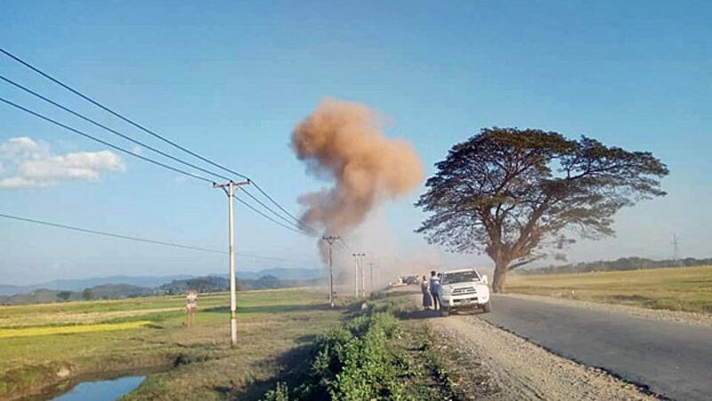 A vehicle in a convoy transporting Rakhine state's chief minister pulls to the side of the road after a mine blast on the outskirts of Mrauk-U township, western Myanmar's Rakhine State, Jan. 1, 2019.