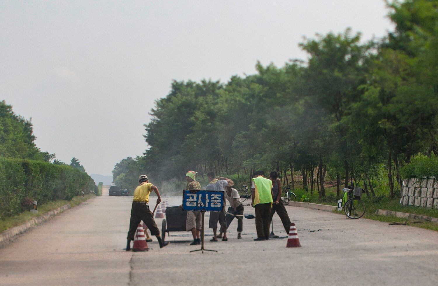 Road rage: North Koreans forced to pitch in and patch potholes