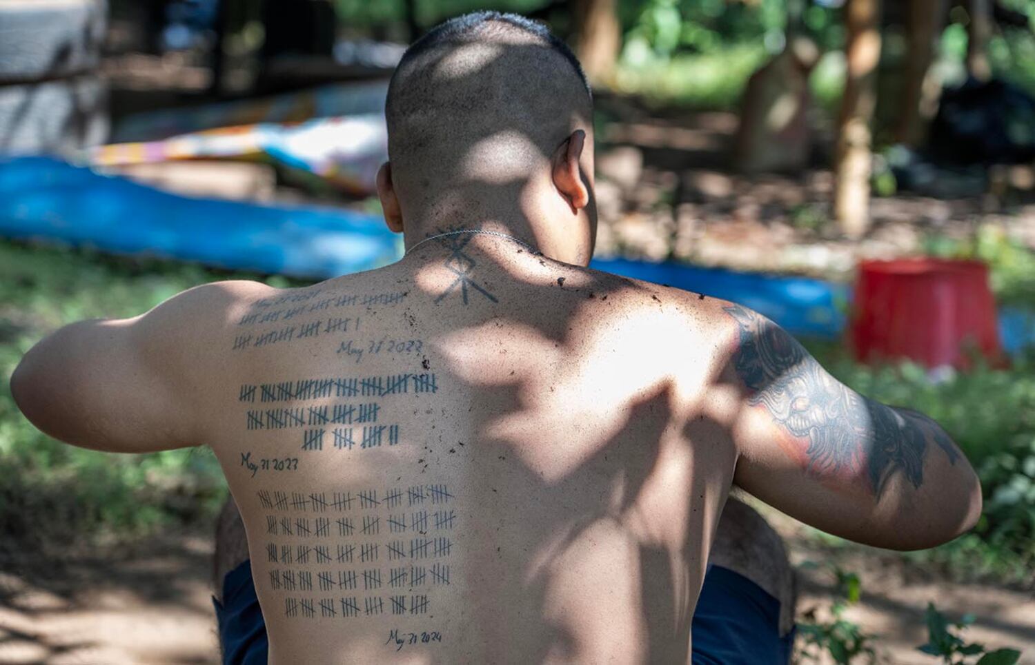 Marwi, a KNDF deputy commander, has tattoos representing each fallen fighter from his base in Demoso, Kayah state, Oct. 30, 2024.