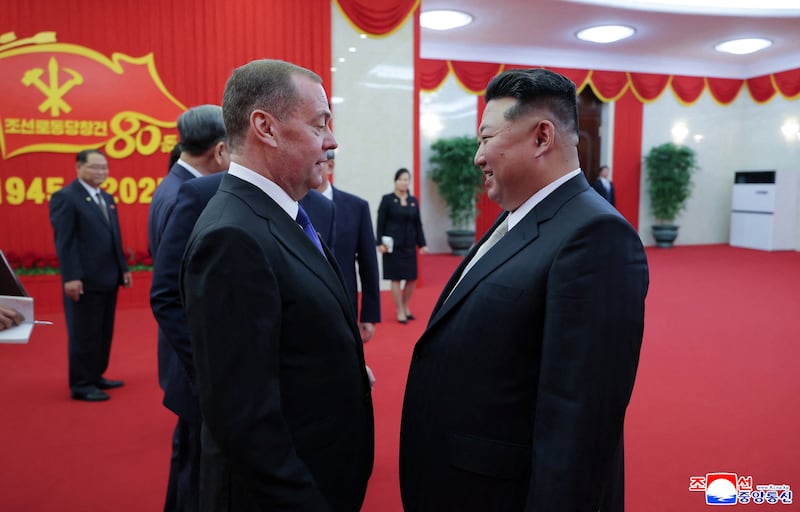 North Korean leader Kim Jong Un speaks with Deputy Chairman of the Russian Security Council and leader of the United Russia political party Dmitry Medvedev as he visits the country for an event marking the 80th anniversary of the founding of the ruling Workers' Party of Korea (WPK), in Pyongyang, North Korea, October 9, 2025, in this pictured released October 10, 2025 by North Korea's official Korean Central News Agency.