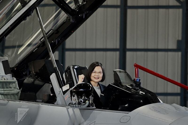 Taiwan President Tsai Ing-wen gestures from an upgraded US-made F-16 V fighter during a ceremony at the Chiayi Air Force in southern Taiwan, Nov. 18, 2021. Credit: AFP