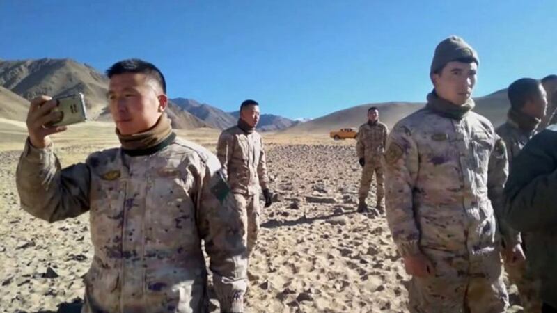 At least a dozen Chinese soldiers, including a few who were seen recording the incident on video, tell local nomads in the Kakjung area of Ladakh to stop grazing their livestock near the Line of Actual Control close to the border of India and Chinese-controlled Tibet, Jan. 2, 2024. (Kunsang Namgyal/video screenshot)